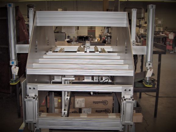 custom product material handling process design build install integrate assembly machine production logistics pneumatic actuation variable sizes